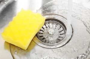 A sponge placed on the kitchen sink