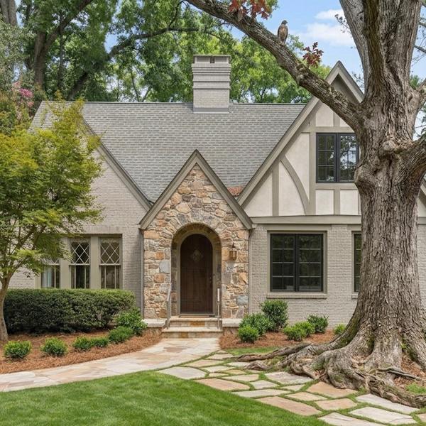 Historic Morningside-Lenox Park stone bungalow with a massive mature oak tree root system near the front yard sewer lateral line.